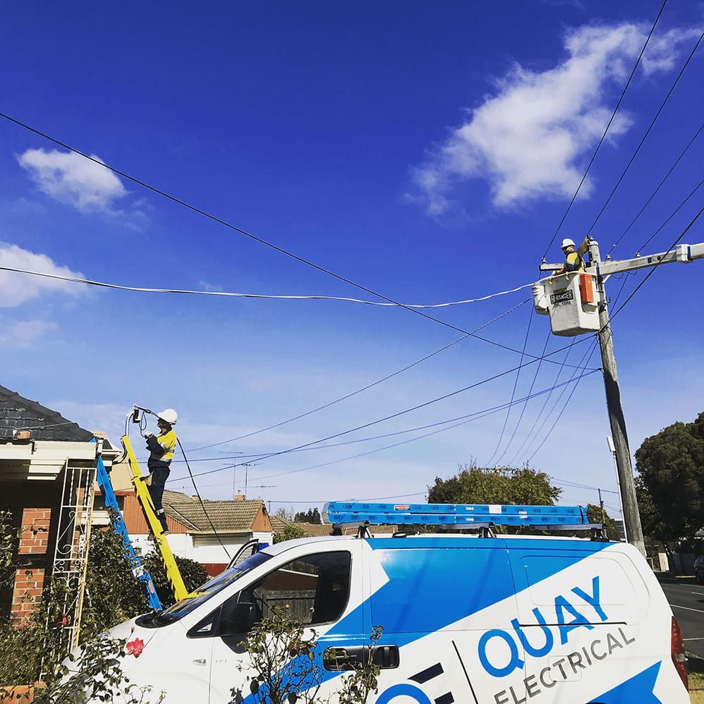 Quay Electrical van and electricians working on overhead power lines